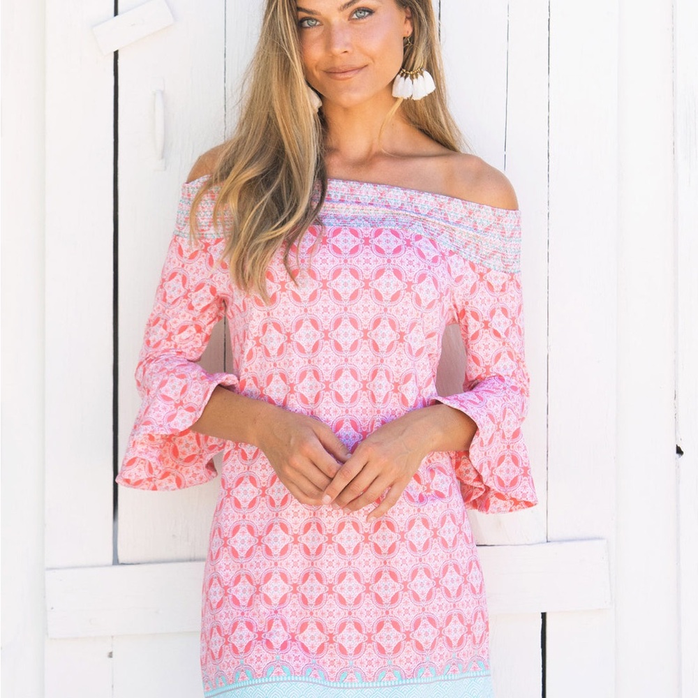 Cabana life smocked dress with tassel finishes.